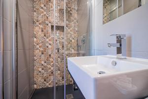 Ванная комната в Buganvilias Do Meco Guest house