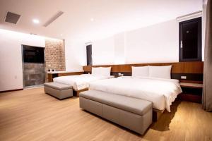 Postel nebo postele na pokoji v ubytování Beauty Avenue Inn + 23 fotografií