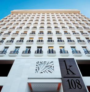 a close up of the front of a building at K108 Hotel Doha in Doha
