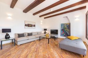 a living room with a couch and a table at Villa Paula in Sveta Marina