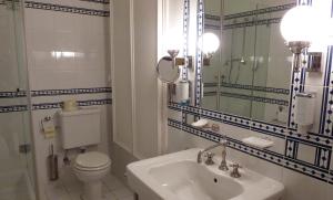 A bathroom at La Scala Apartments