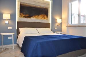 A bed or beds in a room at Beach apartments Isola d'Elba