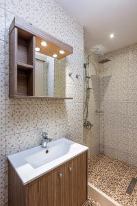 a bathroom with a sink and a shower at Galini Apartments in Hersonissos