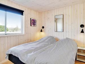Voodi või voodid majutusasutuse Holiday home Grenaa XI toas