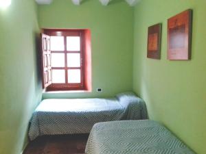 Łóżko lub łóżka w pokoju w obiekcie Casa Julián Fábrica Giner