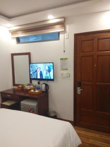 TV a/nebo společenská místnost v ubytování HODI Hotel