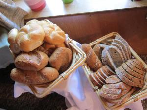 two baskets filled with different types of bread at Hansenhof in Prägraten