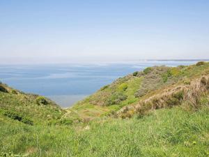 a view of the ocean from the top of a hill at 7 person holiday home in Struer in Remmer Strand