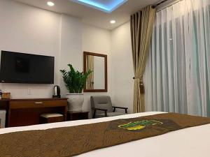 TV a/nebo společenská místnost v ubytování HODI Hotel