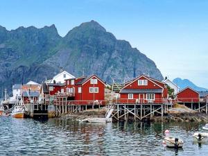 a group of houses on a dock in the water at 3 person holiday home in Henningsv r in Henningsvær