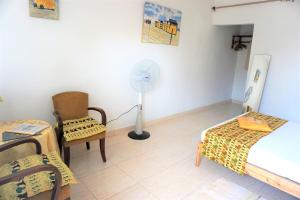 Postel nebo postele na pokoji v ubytování B & B Villa Calliandra
