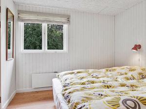 Katil atau katil-katil dalam bilik di Holiday home Roslev III