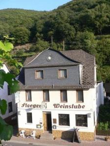 a large white building with a black roof at Steeger Weinstube in Bacharach