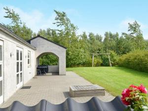 a backyard with a gazebo and a lawn at 6 person holiday home in Hemmet in Hemmet