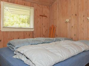Säng eller sängar i ett rum på Holiday home Nørre Nebel XXI