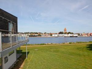a building with a view of a body of water at 7 person holiday home in Stege in Stege