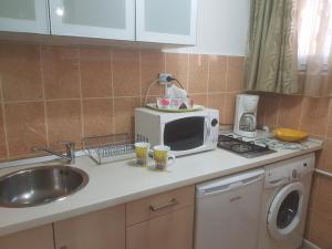 Kuchyň nebo kuchyňský kout v ubytování Calea Victoriei Residence