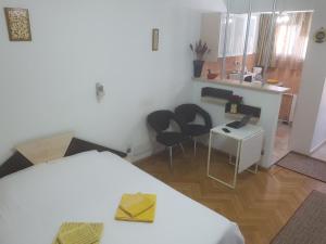Postel nebo postele na pokoji v ubytování Calea Victoriei Residence + 32 fotografií