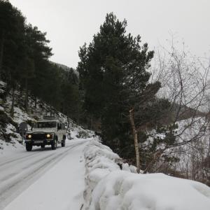 a jeep driving down a snow covered road at Hotel Saurat in Espot