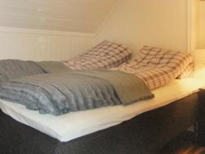 two beds sitting on a wooden platform in a bedroom at 6 person holiday home in Gursken-By Traum in Larsnes +24 photos