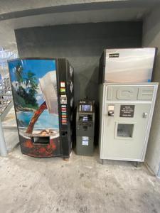 a gas pump and an atm machine in a building at Golden West Manor Motel in Los Angeles