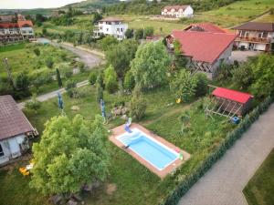 an aerial view of a house with a swimming pool at Pensiunea Maria Sibiu in Sibiu
