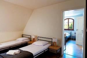 Łóżko lub łóżka w pokoju w obiekcie Hotel Spichlerz Pierwszy SPA & WELLNESS