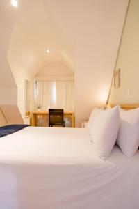 En eller flere senge i et værelse på Pousada Campos dos Holandeses - Campos do Jordao
