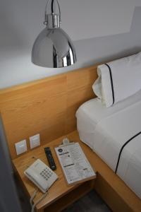 Postel nebo postele na pokoji v ubytování Hotel Perla Central + 37 fotografií