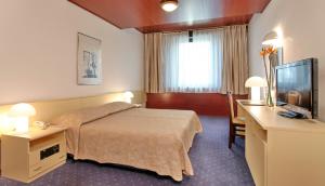 Posteľ alebo postele v izbe v ubytovaní Hotel Slavija Lux