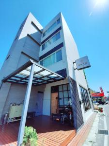a building with a bike parked in front of it at Love Travel Guest House in Taitung City