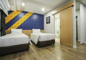 Ένα ή περισσότερα κρεβάτια σε δωμάτιο στο Hotel Fuse Rayong
