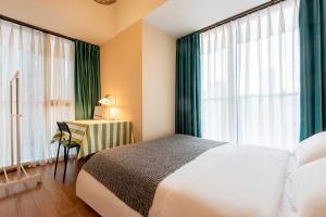 Postel nebo postele na pokoji v ubytování S6 Service Apartment（Chengdu Chunxi Road Taikoo Li Branch）
