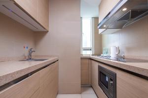 Kuchyň nebo kuchyňský kout v ubytování S6 Service Apartment（Chengdu Chunxi Road Taikoo Li Branch）