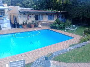 a swimming pool in the backyard of a house at Johannesburg Youth Hostel in Johannesburg