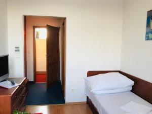 Postel nebo postele na pokoji v ubytování Hotel Nostalgia