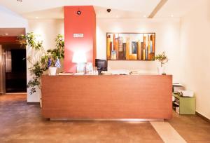 a reception area of a hospital with a reception desk at Astros Beach Boutique Hotel in Paralion astros