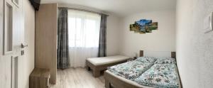 Posteľ alebo postele v izbe v ubytovaní Apartmán Pod Klinom