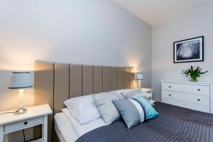 Tempat tidur dalam kamar di Vanilla Rentyear Apartments