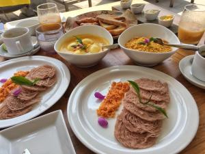 
plates of food on a table at Airport Green Olive Villa in Katunayaka
