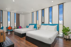 Postel nebo postele na pokoji v ubytování Platinum Danang Hotel + 37 fotografií