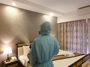 Ein Bett oder Betten in einem Zimmer der Unterkunft Aristocrat Residence & Hotel