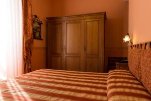 Postel nebo postele na pokoji v ubytování Hotel Belle Epoque