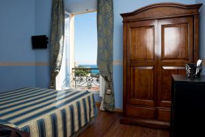Postel nebo postele na pokoji v ubytování Hotel Belle Epoque