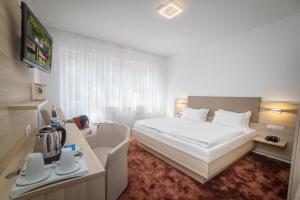 Postel nebo postele na pokoji v ubytování Hotel Brenner