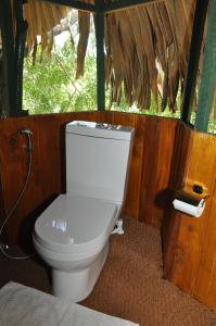 a bathroom with a toilet in a cabin at Yala Beddegama Eco in Kataragama