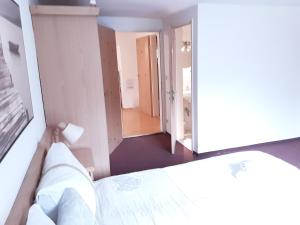Posteľ alebo postele v izbe v ubytovaní Apartment House Seerose