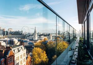 a view of a city from a building window at Assembly Leicester Square in London