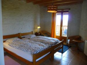 Ein Bett oder Betten in einem Zimmer der Unterkunft La grange