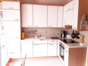 Kuchyňa alebo kuchynka v ubytovaní Apartment House Seerose